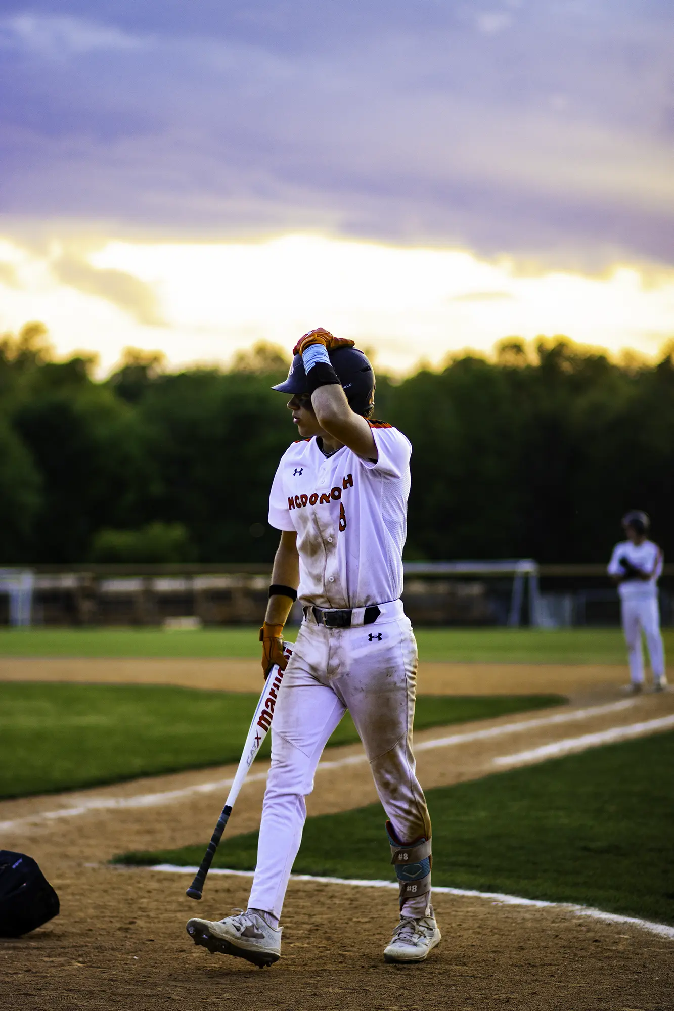 MO Photos — a baseball walkoff celebration captured at the moment of impact
